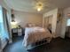 Bedroom with pink bedding and mirrored closet doors at 737 Butternut Pl, Lakeland, FL 33813