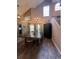 Dining room with a large wooden table, high ceilings and hardwood floors at 737 Butternut Pl, Lakeland, FL 33813