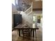 Dining room with a large wooden table, high ceilings and hardwood floors at 737 Butternut Pl, Lakeland, FL 33813