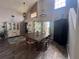Dining room with a large wooden table, high ceilings and hardwood floors at 737 Butternut Pl, Lakeland, FL 33813