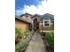 Front entrance with red door, landscaping, and walkway at 737 Butternut Pl, Lakeland, FL 33813