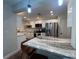 Open concept kitchen with breakfast bar and granite countertops at 737 Butternut Pl, Lakeland, FL 33813