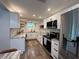 Modern kitchen with stainless steel appliances and granite countertops at 737 Butternut Pl, Lakeland, FL 33813