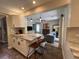 Open kitchen with breakfast bar, view into living room at 737 Butternut Pl, Lakeland, FL 33813