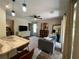 Living room with open floor plan, view of kitchen and backyard at 737 Butternut Pl, Lakeland, FL 33813