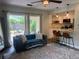 Living area with view of kitchen and access to backyard patio at 737 Butternut Pl, Lakeland, FL 33813