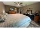 Main bedroom with king-size bed, ample dresser space, and ceiling fan at 737 Butternut Pl, Lakeland, FL 33813