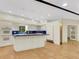 Bright kitchen with white cabinets, blue tile backsplash, and large island at 14 Casa Loma Way, Lakeland, FL 33813