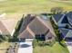 Aerial view of a house with solar panels and a landscaped yard at 1898 Charleston Ln, Bartow, FL 33830