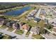 Aerial view of neighborhood, highlighting the home's location near a lake at 1898 Charleston Ln, Bartow, FL 33830