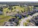 Aerial view of the home and community, showcasing the surrounding landscape at 1898 Charleston Ln, Bartow, FL 33830
