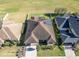 Aerial view of a house with solar panels and a landscaped yard at 1898 Charleston Ln, Bartow, FL 33830