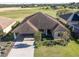 Aerial view of a house with solar panels and a landscaped yard at 1898 Charleston Ln, Bartow, FL 33830