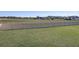 Large backyard with a white fence and open field view at 1898 Charleston Ln, Bartow, FL 33830