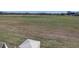Large backyard with a white fence and open field view at 1898 Charleston Ln, Bartow, FL 33830