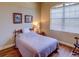 Bedroom with a double bed, hardwood floors, and large window at 1898 Charleston Ln, Bartow, FL 33830