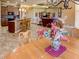 Kitchen with breakfast bar and adjoining dining area with wood table at 1898 Charleston Ln, Bartow, FL 33830