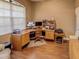 Spacious home office with corner desk and hardwood floors at 1898 Charleston Ln, Bartow, FL 33830