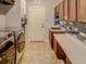 Laundry room with washer, dryer, and built in cabinets at 1898 Charleston Ln, Bartow, FL 33830