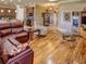 Open concept living room with hardwood floors and kitchen view at 1898 Charleston Ln, Bartow, FL 33830