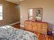 Main bedroom with wood dresser and a large mirror at 1898 Charleston Ln, Bartow, FL 33830