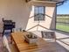 Covered patio features a table, chairs, and grill with a view at 1898 Charleston Ln, Bartow, FL 33830