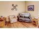 Cozy sitting area with leather couch and arm chair at 1898 Charleston Ln, Bartow, FL 33830