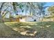 Large backyard with grassy area and wooden fence at 2650 Jungle St, Lakeland, FL 33801