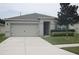 One-story house with attached garage and landscaped front yard at 3136 Country Club Cir, Winter Haven, FL 33881