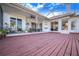 Spacious screened patio with wooden deck at 4402 Fairway Oaks Ct, Mulberry, FL 33860