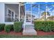 Wooden steps leading to a screened patio at 4402 Fairway Oaks Ct, Mulberry, FL 33860