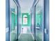 Shared bathroom with mirrored doors and light teal walls at 4402 Fairway Oaks Ct, Mulberry, FL 33860