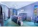 Spacious Primary bedroom with large bed and access to a patio at 4402 Fairway Oaks Ct, Mulberry, FL 33860
