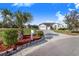 Single-story home with a two-car garage and landscaped front yard at 4402 Fairway Oaks Ct, Mulberry, FL 33860