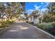 Community entrance with guard house and landscaped entryway at 4402 Fairway Oaks Ct, Mulberry, FL 33860