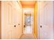 Hallway with light walls, carpet, and access to bathroom at 4402 Fairway Oaks Ct, Mulberry, FL 33860
