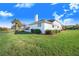 House exterior showcasing the side yard and landscaping at 4402 Fairway Oaks Ct, Mulberry, FL 33860