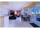 Open kitchen and living area with access to a deck and view of water at 4402 Fairway Oaks Ct, Mulberry, FL 33860