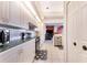 Bright kitchen with white cabinets, green countertops and stainless steel appliances at 4402 Fairway Oaks Ct, Mulberry, FL 33860