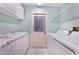 Laundry room with washer, dryer, and cabinets at 4402 Fairway Oaks Ct, Mulberry, FL 33860