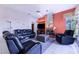 Living room with fireplace, leather furniture and a view at 4402 Fairway Oaks Ct, Mulberry, FL 33860