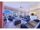 Living room with fireplace, leather recliners and access to a lanai at 4402 Fairway Oaks Ct, Mulberry, FL 33860