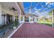 Screened patio with access to the backyard at 4402 Fairway Oaks Ct, Mulberry, FL 33860