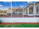 View of the backyard through a screened enclosure at 4402 Fairway Oaks Ct, Mulberry, FL 33860