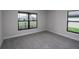 Well-lit bedroom with carpet and window views at 4645 Grandview Glen Dr, Auburndale, FL 33823