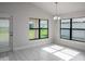 Bright dining area with gray tile floors and large windows at 4645 Grandview Glen Dr, Auburndale, FL 33823