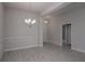 Bright dining room with elegant chandelier and wood-look tile floors at 4645 Grandview Glen Dr, Auburndale, FL 33823