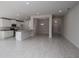 Open kitchen with white cabinets, granite counters, and stainless steel appliances at 4645 Grandview Glen Dr, Auburndale, FL 33823
