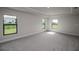 Spacious main bedroom with carpet and large windows at 4645 Grandview Glen Dr, Auburndale, FL 33823