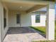 Covered patio with paver stones and access to backyard at 4645 Grandview Glen Dr, Auburndale, FL 33823